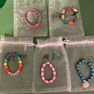 Clay head bracelets, five